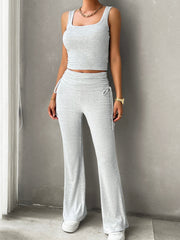 Light gray ribbed tank top and ruched waist flare pants set with drawstring detail.