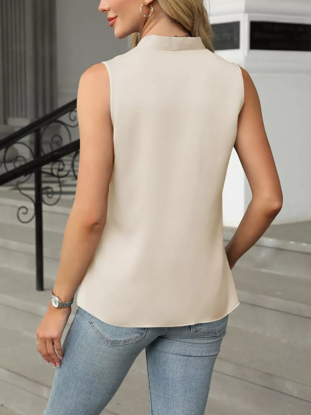 Apricot satin V-neck tank top with a high neckline and sleeveless cut.