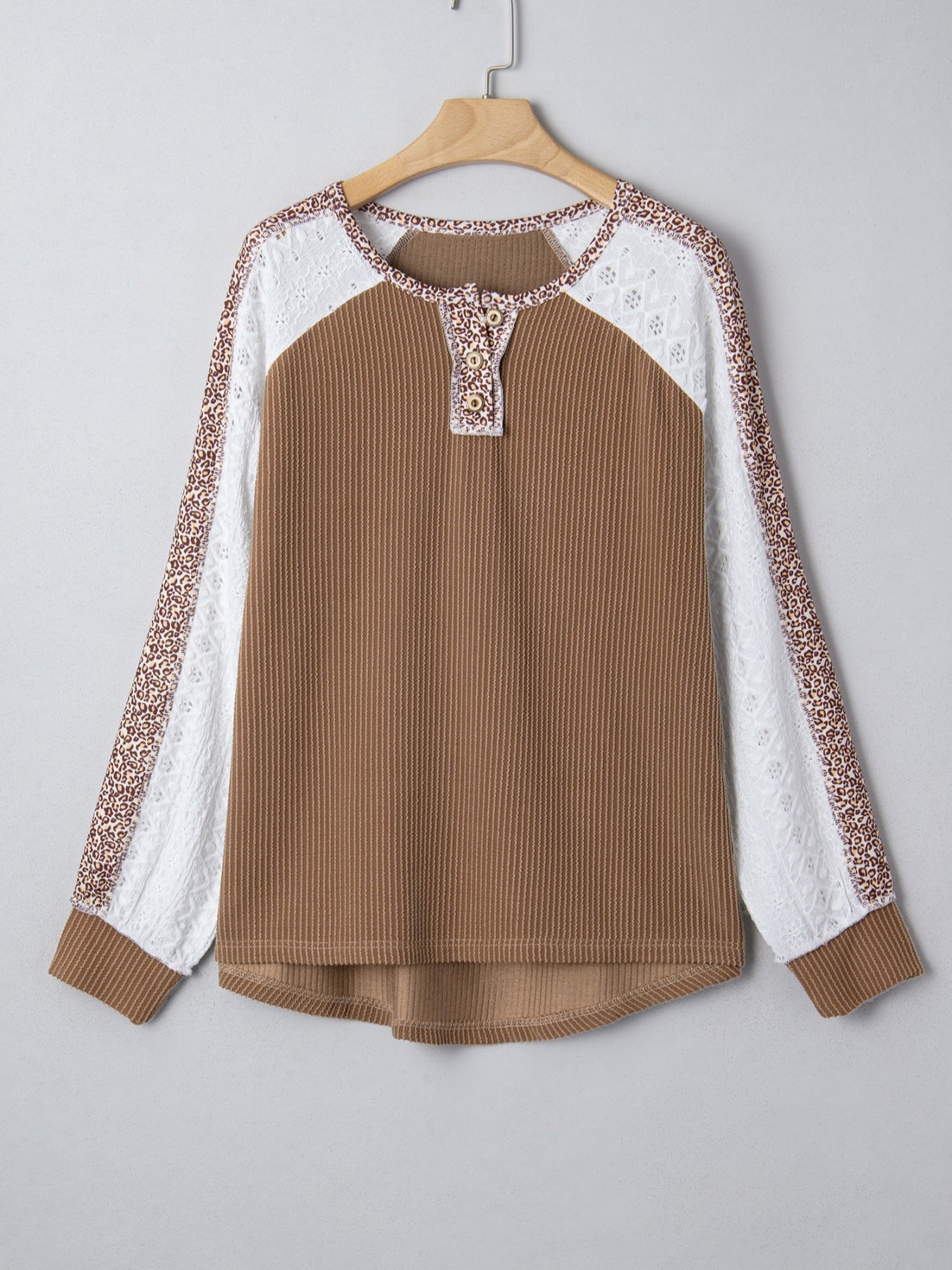 Taupe waffle knit henley top with lace and animal print sleeves.
