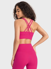 Hot Pink sports bra with crisscross back straps and a wide band.