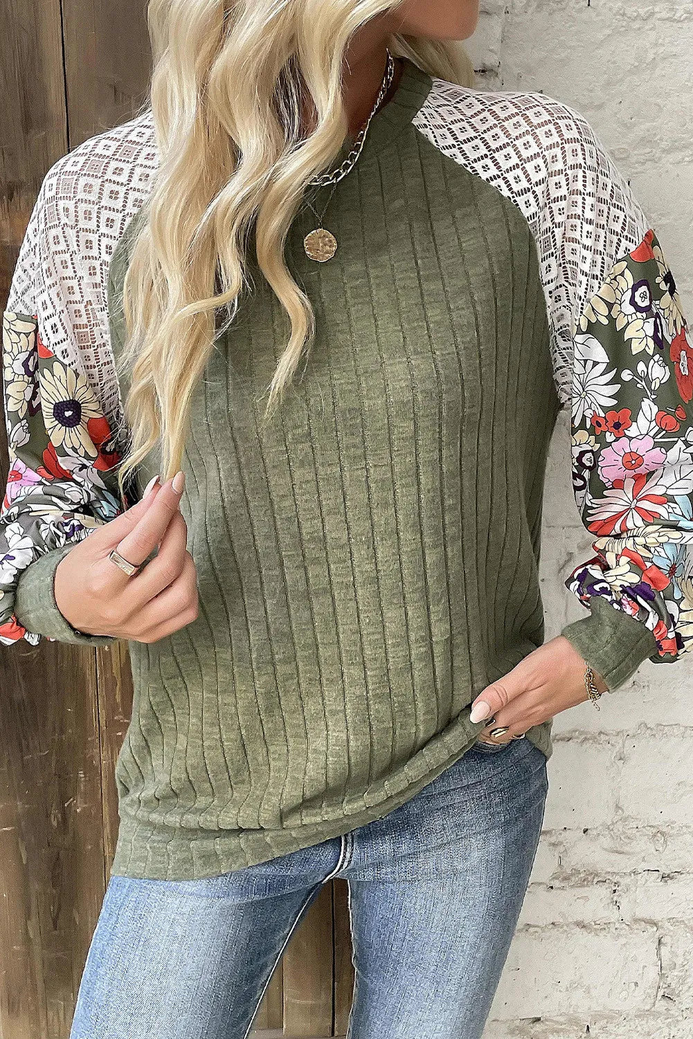 Moss green ribbed knit top with floral print and lace raglan sleeves