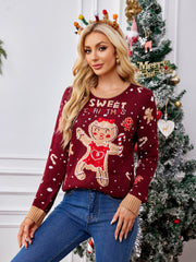 Burgundy acrylic knit sweater with gingerbread man graphic and SWEET CHRISTMAS text.