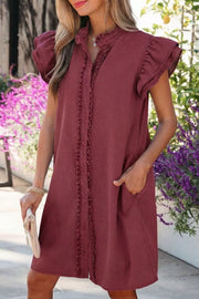 Ruffled button-down denim mini dress with ruffled sleeves and pockets.
