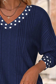 Navy ribbed blouse with polka dot V-neck and cuffs