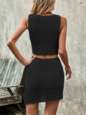 Black crochet vest and mini skirt set with eyelet detail, casual boho style.