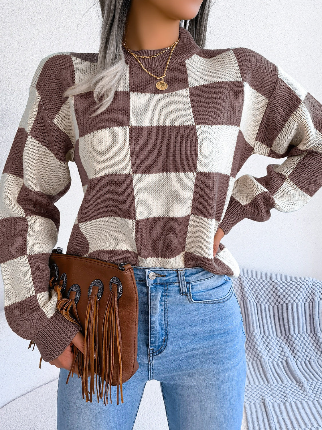 Checkerboard knit mock neck pullover sweater in brown and beige acrylic.