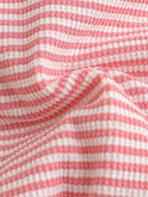 Pink and white striped baby set fabric detail