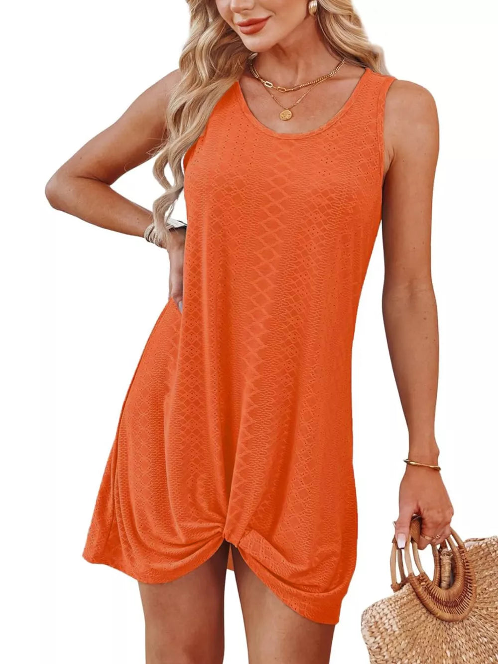 Orange eyelet tank dress with twisted hem detail and scoop neckline.