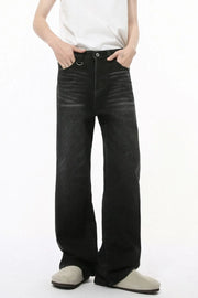 Dark wash wide leg denim jeans with statement pockets and a metal ring detail.
