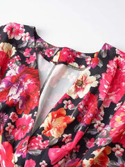 Black floral ruffle hem mini dress with a V-neckline and short sleeves.