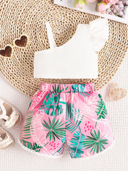 Baby girl's white asymmetrical top with ruffled sleeve and pink floral shorts.