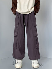 Men's cargo sweatpants in Mauve with drawstring waist and multiple zippered pockets.