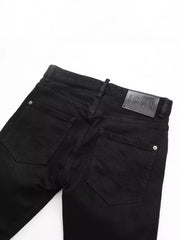 Black cotton slim fit jeans with back pocket detail and leather logo patch.