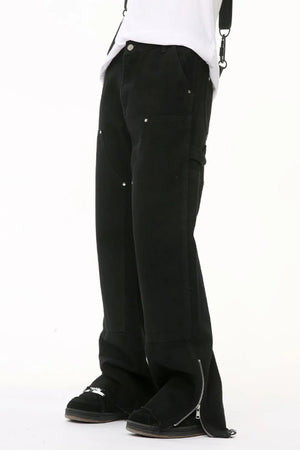 Black bootcut denim pants with zip hem detail and utility pockets.