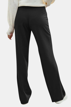 Black wide leg trousers with button detail, shown from the back.