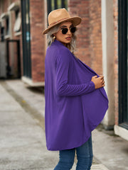 Electric purple asymmetrical drape front cardigan with long sleeves.