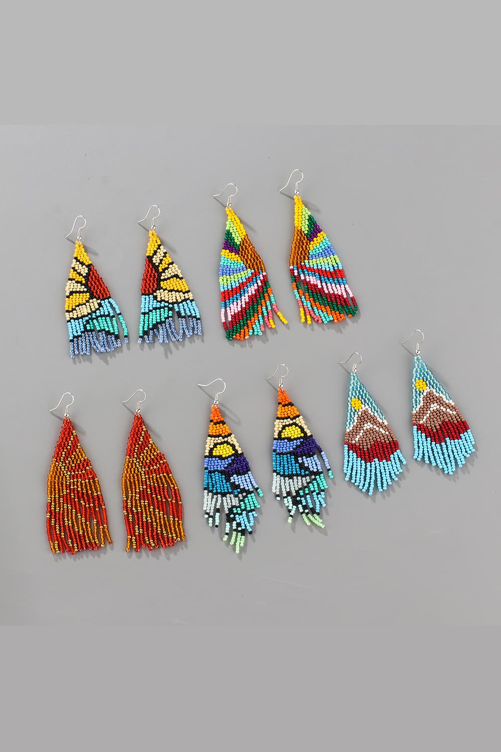 Women's beaded fringe earrings in colorful geometric and landscape patterns