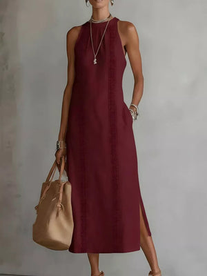 Burgundy sleeveless midi dress with geometric trim and pockets.