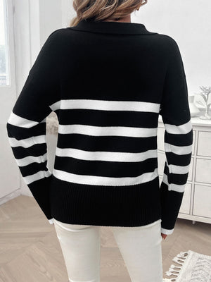 Black and white striped knit polo sweater with a collar.