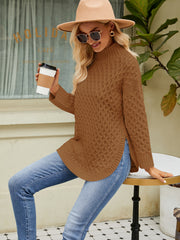 Textured diamond knit turtleneck sweater in caramel acrylic with side slits.