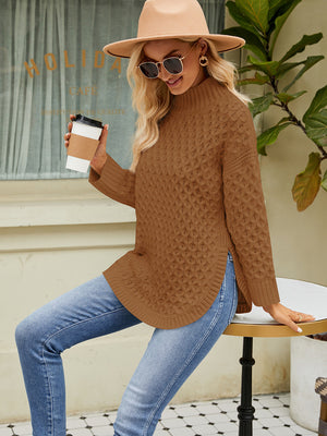 Textured diamond knit turtleneck sweater in caramel acrylic with side slits.