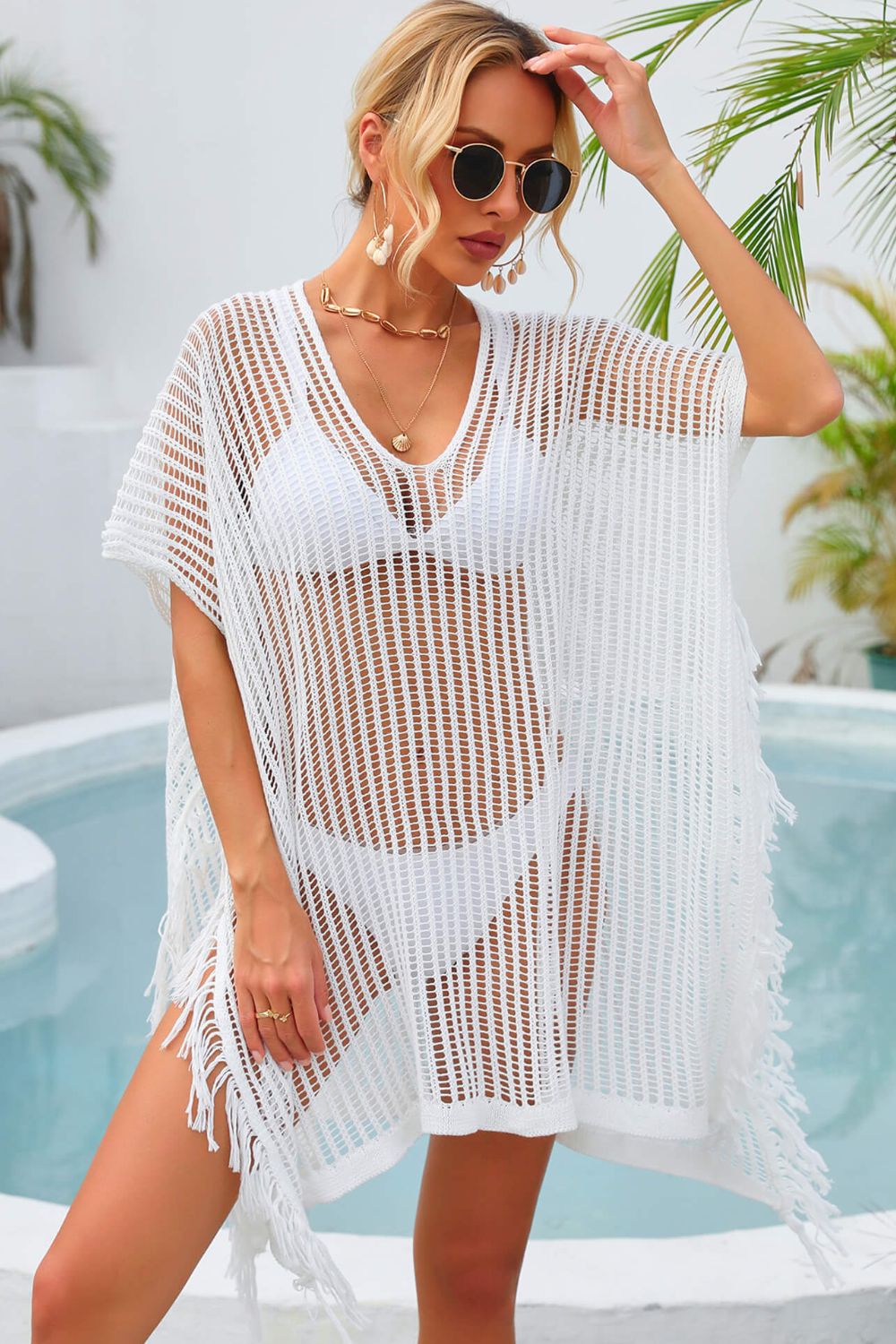 White open-knit beach cover-up with fringe detail and V-neck.