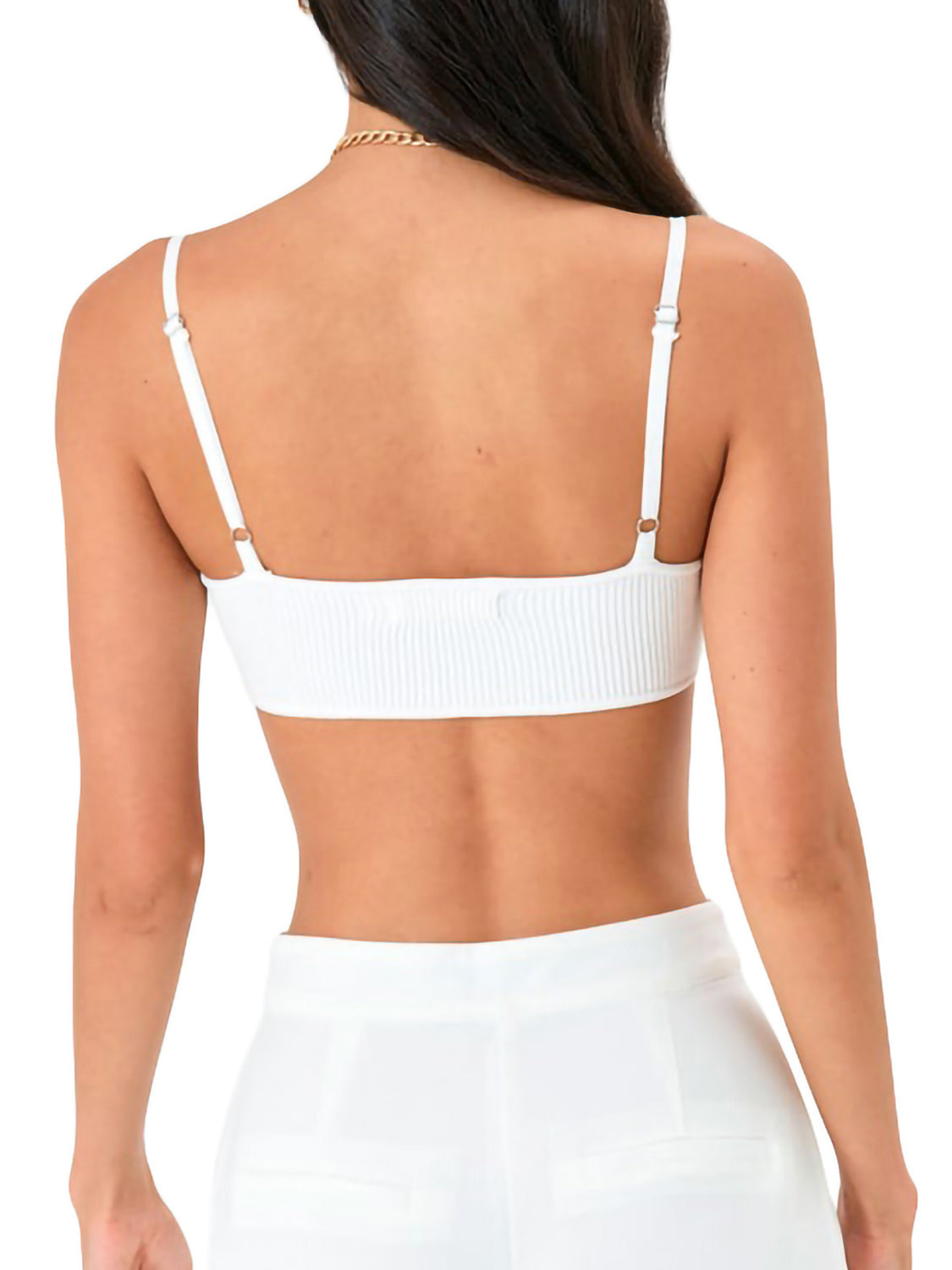 White ribbed knit bustier with delicate adjustable straps shown from the back.