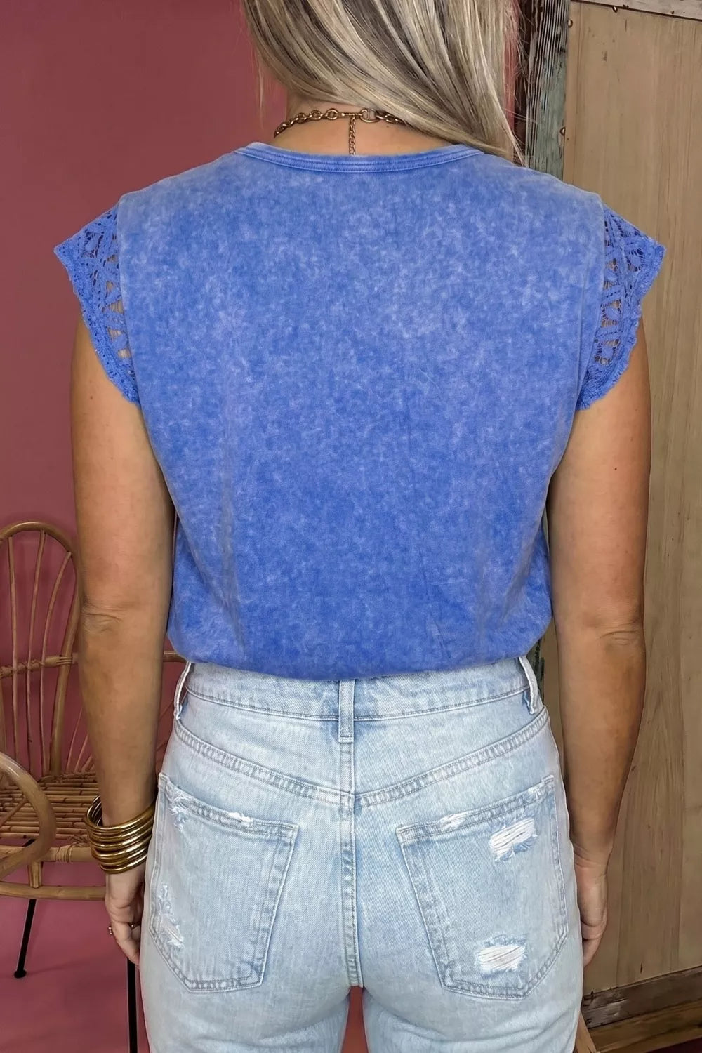 Blue mineral wash cotton tee with distressed details and lace cap sleeves.