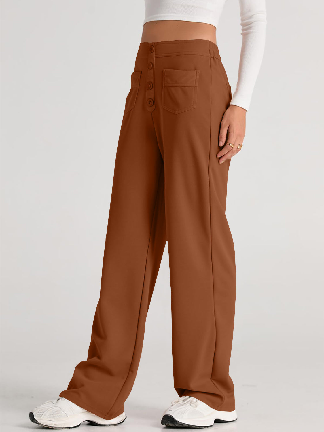 Button-front palazzo trousers in caramel with wide legs and pocket details.
