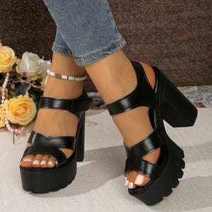 Black two-tone open-toe block heel sandals with chunky platform sole and ankle strap.