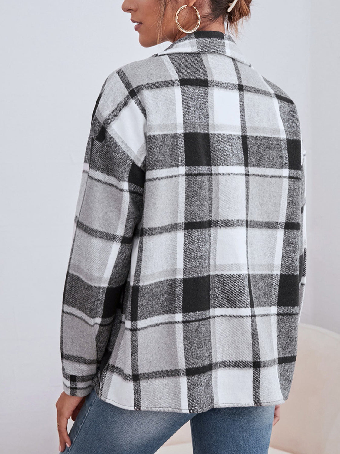 Oversized plaid shacket with button closure in black, white, and grey.