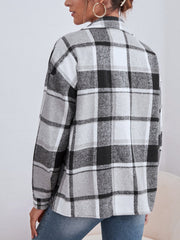 Oversized plaid shacket with button closure in black, white, and grey.