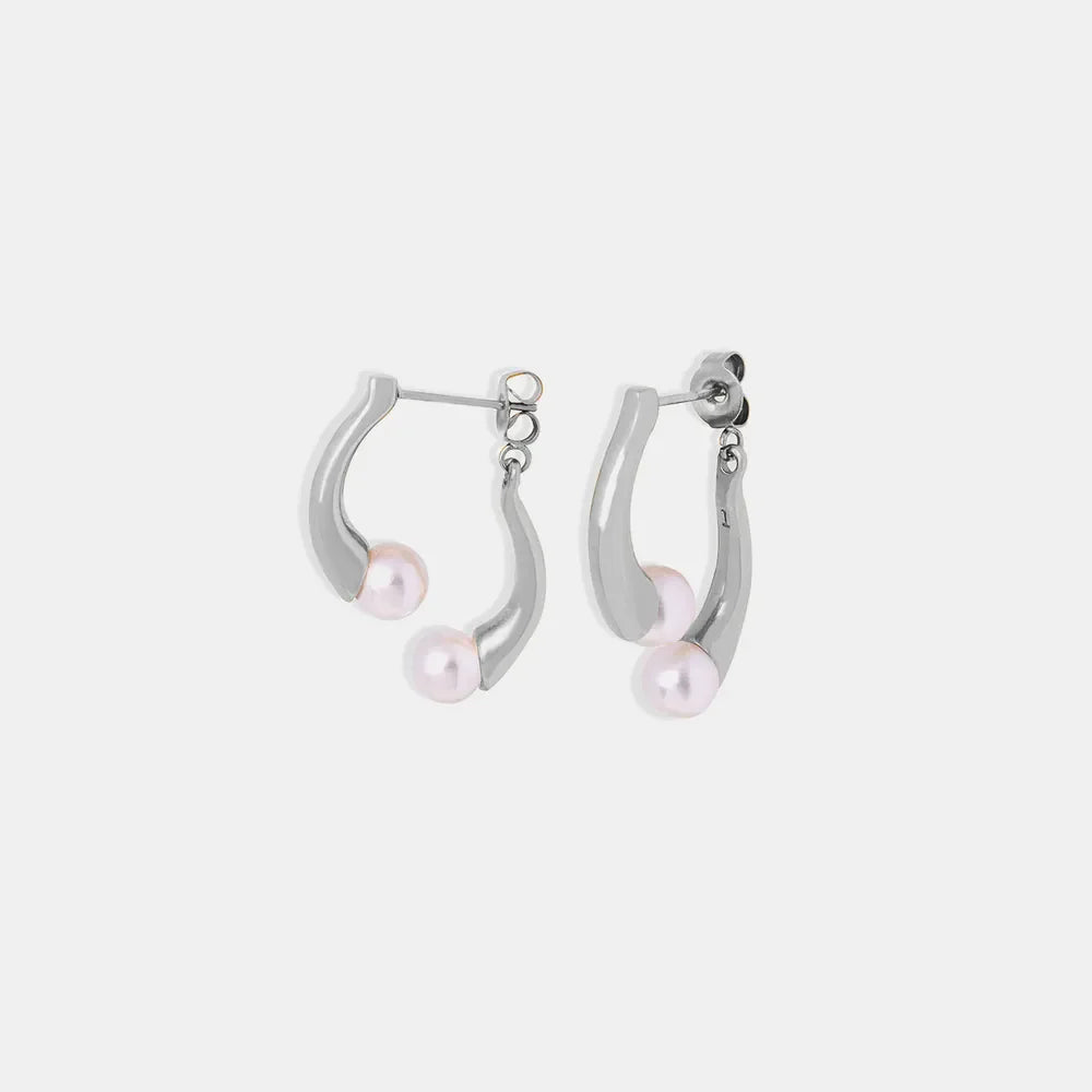 Silver sculptural drop hoop earrings with pearl accents