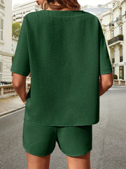 Dark green waffle knit drawstring co-ord set with short sleeves and shorts.