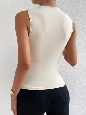 Apricot ruched mock-neck tank top with subtle ruching detail.