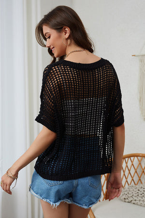Black open-knit slouchy shoulder cover-up with short sleeves and a relaxed fit.