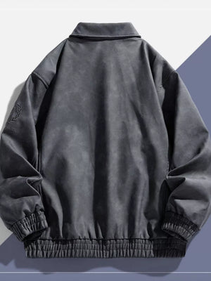 Gray bomber jacket with elastic cuffs, classic collar, and embroidered detail on sleeve.