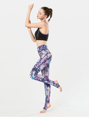Prism Palm Stirrup Performance Leggings in multi-color abstract leaf print with stirrup foot detail.