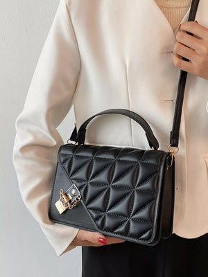 Black diamond quilted PU leather crossbody bag with gold lock detail.