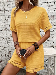 Textured knit set in gold with short sleeves and fringe detail on hem and cuffs.