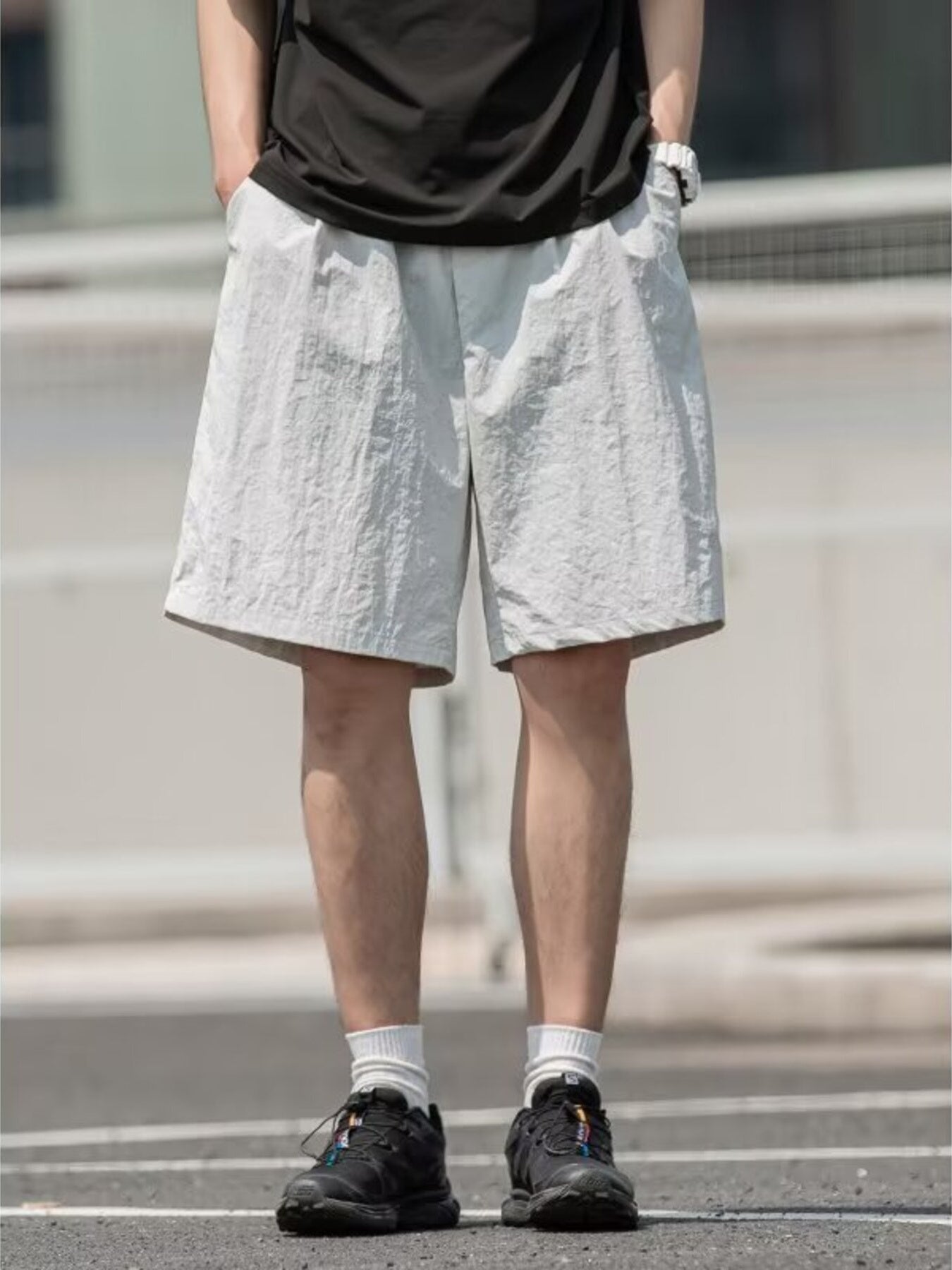 Men's light gray textured drawstring shorts with a casual fit.
