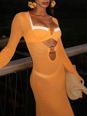 Tangerine knit maxi dress with bell sleeves, keyhole cutout, and ring detail.
