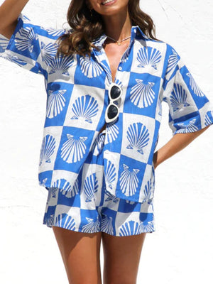 Blue and white checkered resort set with shell print, button-up shirt and shorts.
