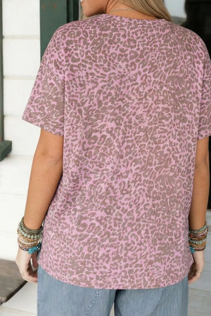 Pink leopard print polyester t-shirt with short sleeves and a crew neck.