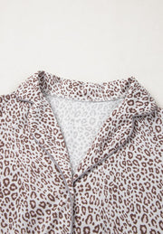 Leopard print pajama top with button-down front and notched collar.