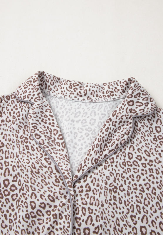 Leopard print pajama top with button-down front and notched collar.