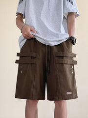 Men's brown cargo shorts with drawstring waist and multiple flap pockets.