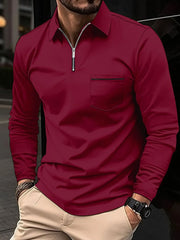 Burgundy zip-front polo shirt with contrast pocket detail and long sleeves.