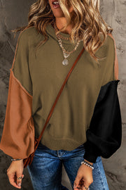 Chic contrast sweater in moss with balloon sleeves in tan and black, crew neck, ribbed cuffs and hem.