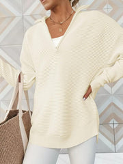 Cream ribbed knit funnel neck pullover sweater with quarter zip and long sleeves.